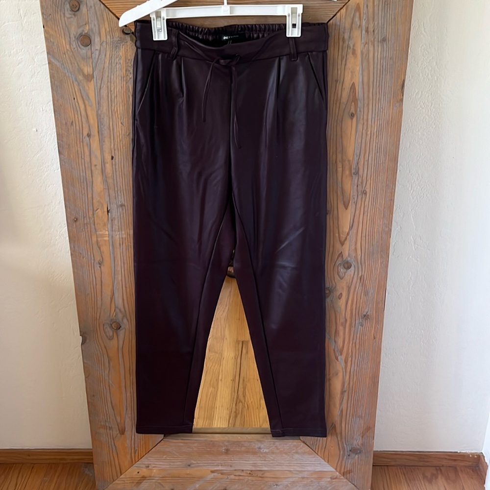 Dark brown fake leather jogger style pants. Size M